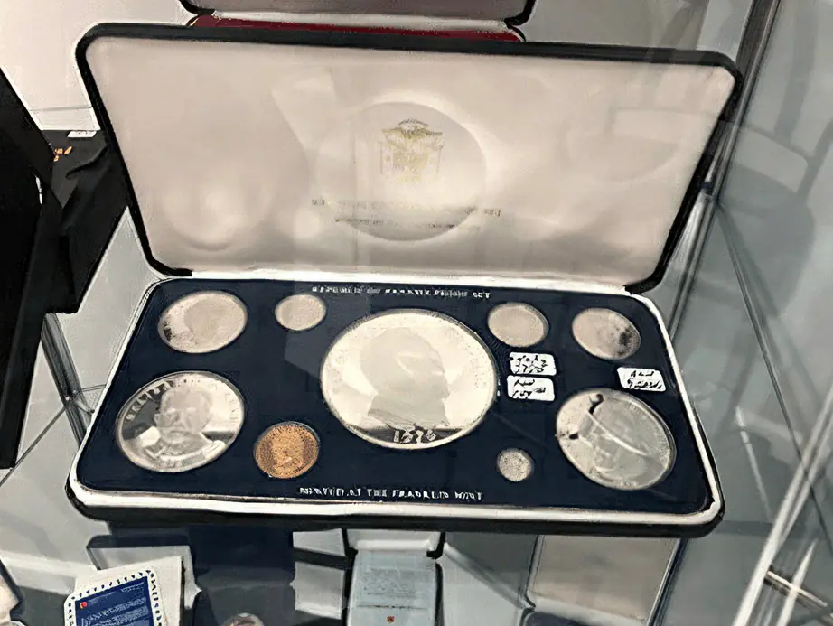 A proof set of silver coins in a velvet presentation case